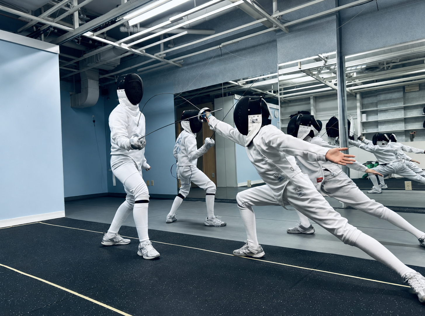 Épée fencers training at Knight Fencing Academy